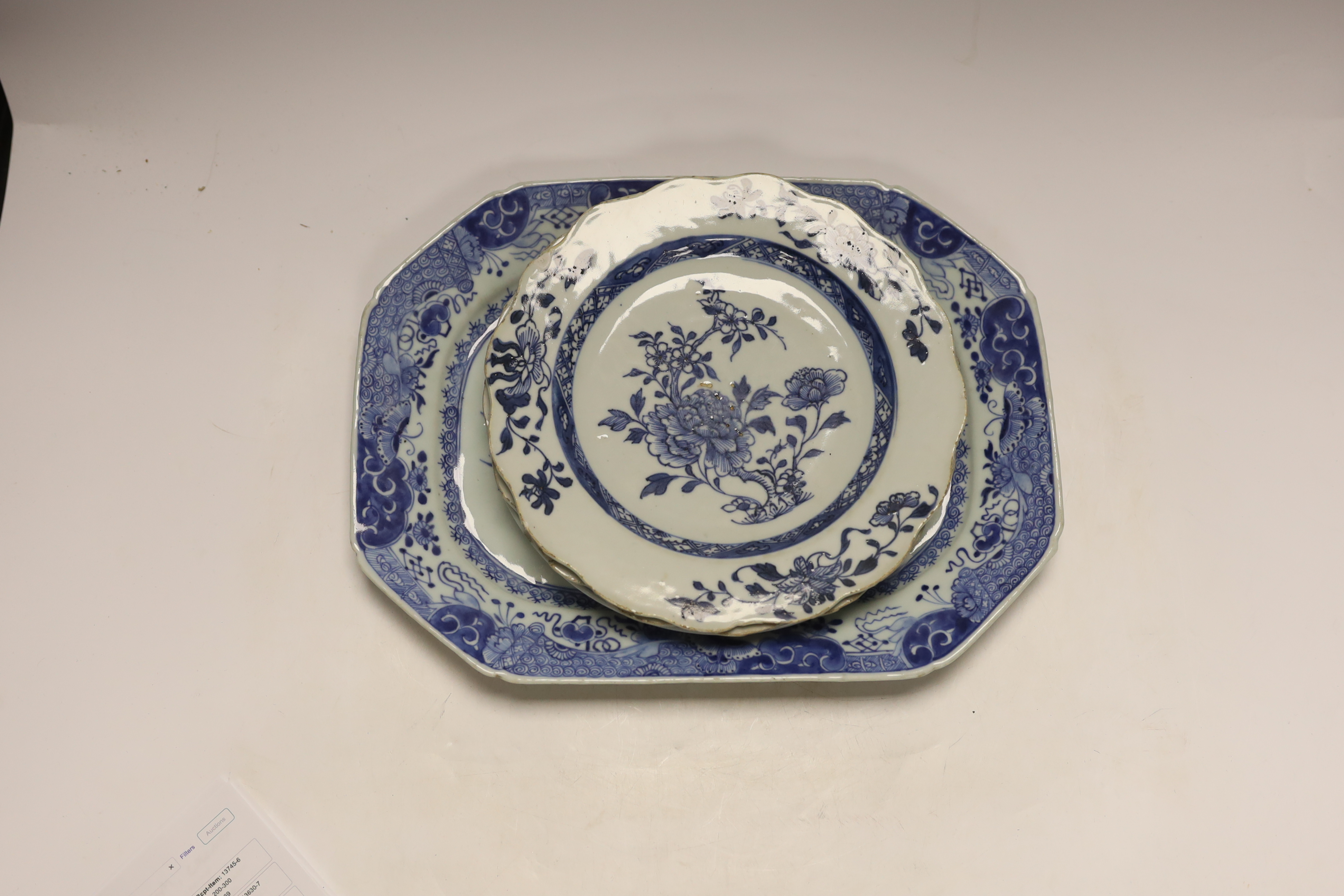 A Chinese blue and white meat plate and three plates, 18th century, meat plate 35cm wide